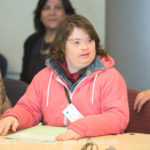 A young lady speaking at the self-advocacy meeting in Israel