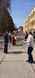 Children and adults play on a street