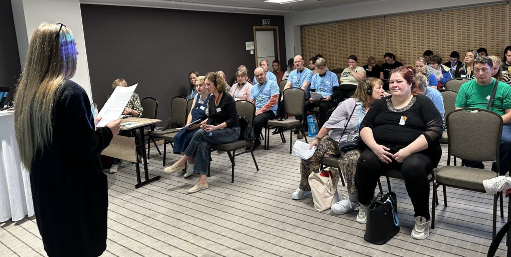 Speaker and participants at Hear our Voices in Tallinn